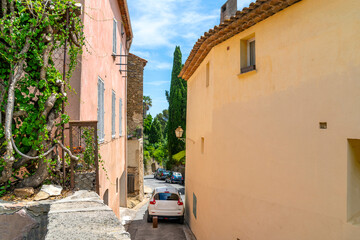 A narrow street winding to the top of the medieval town of Grimaud, France.
