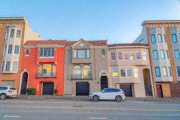 Fototapeta na wymiar Rowhouses in San Francisco, California with metal gate doors and attached garages