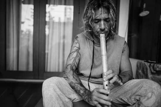 bw portrait of a  musician playing flute