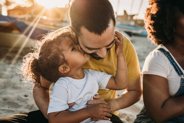 Daughter kissing dad