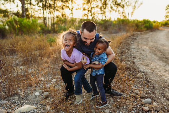 Dad Hugs Girls