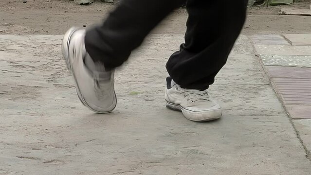 Young Dancer Doing Some Chacarera Steps, Chacarera is an Argentine Folklore Dance originated in Santiago del Estero province, Argentina. Low Angle View.