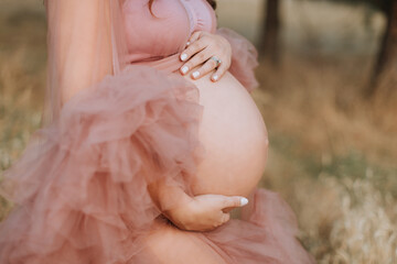 Closeup of Round, Pregnant Belly during Maternity Shoot