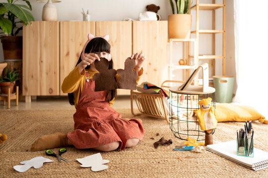 Girl making crafts at home