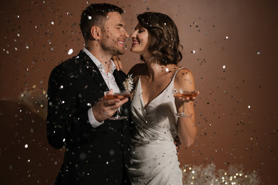 Happy Newlyweds With Glasses Of Wine