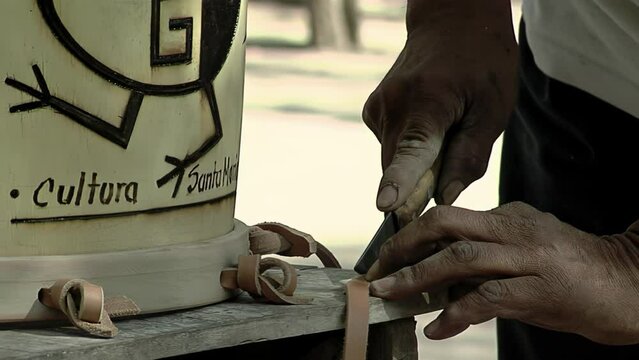 Drum Maker Making a "Bombo Leguero", an Argentine Drum made with Wood and Animal Leather, used in Local Traditional Folklore Music. Close Up.