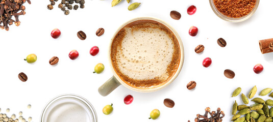 Creative layout made of coffee and spices on the white background. Flat lay. Food concept. Macro  concept.coffee,cappuccino,beans,cardamom,cloves,milk,brown sugar on the white background.