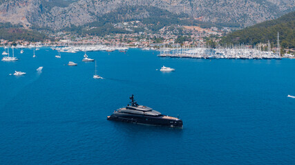 drone View Of a black super yacht in Turkish marina