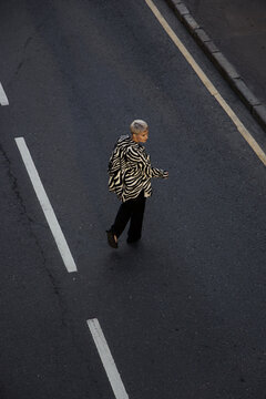 Woman crossing a road