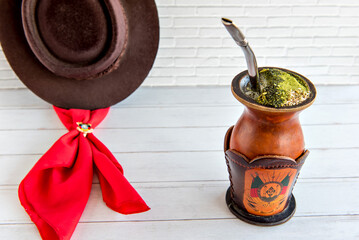 Chimarrao of yerba mate (Ilex paraguariensis) scarf and gaucho hat.