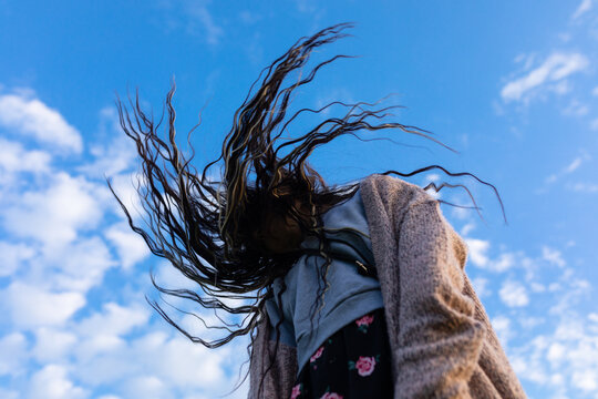 the wind blows a woman's hair