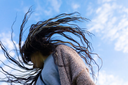 girl dancing against the sky