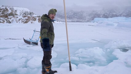 Arctic Polar circle sea ice: Inuit seal hunter, Uummannaq, Greenland