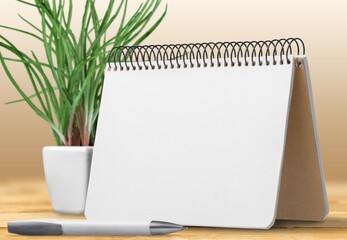 The 2022 desk calendar on wooden table.