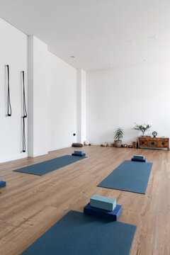 Spacious yoga studio with mats and blocks