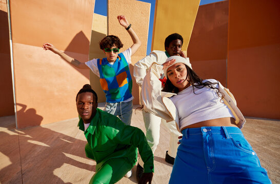 Multiracial young dancers performing in park