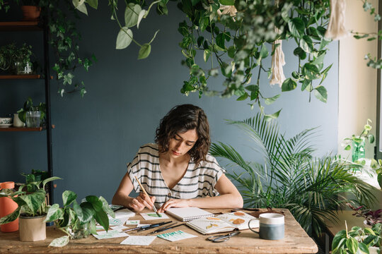 Girl Painting Leaves With Watercolours