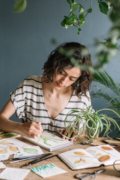Girl Painting Leaves With Watercolours