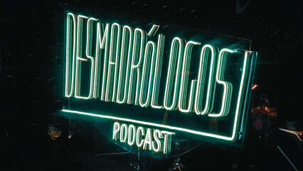 Title of a podcast in illuminated green letters