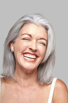 Close-up portrait of mature woman laughing