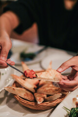 Bread eat with chopped fresh tomato, olive oil flavored with garlic for appetizer. Italian and French food. Dinner table concept.