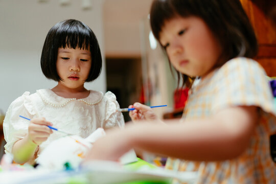  kids doodle with watercolor on mask