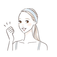 スキンケアを頑張るガッツポーズの女性