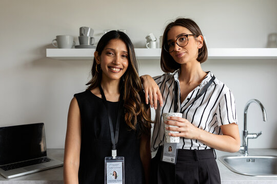Colleagues in office drinking coffee