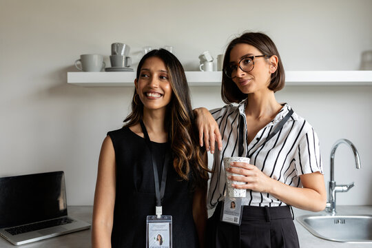 Businesswomen in office kitchen portrait