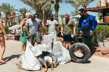 Group of Diverse Activist People Cleaning the Ocean