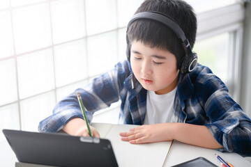 Boy teaches online class on a tablet