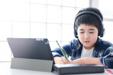 Boy teaches online class on a tablet