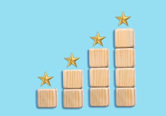 Wooden blocks with the five star symbol for Increase rating, Customer experience