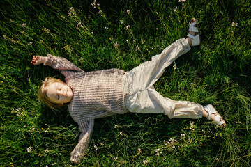 Child lying in grass