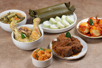 Lontong Lebaran, served with sambal goreng, opor ayam, sayur labu siam, rendang and telur balado....