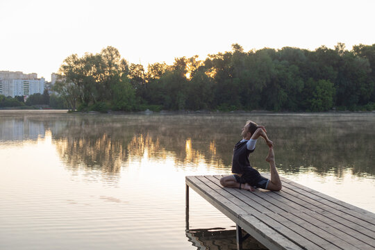 yoga at dawn by the lake