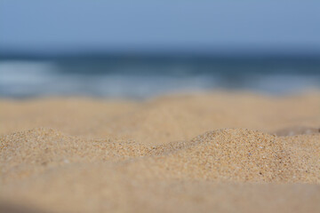 Fototapeta na wymiar Beautiful sandy beach near sea, closeup view