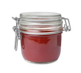 Tasty ketchup in glass jar isolated on white