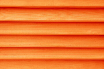 Texture of orange wooden planks as background, top view