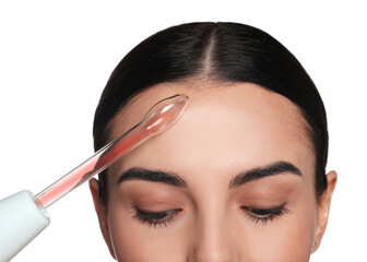 Woman using high frequency darsonval device on white background, closeup