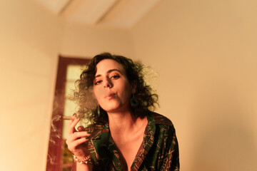 Woman blowing weed smoke