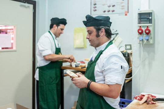 butchers taking a break in a butcher shop