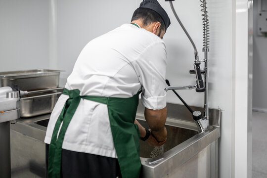 cook washing his hands
