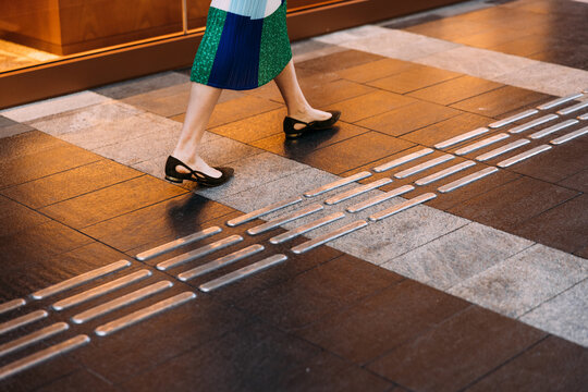 Female legs on the road