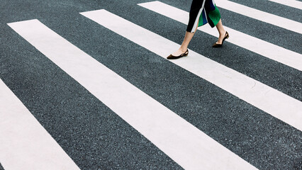Female legs on zebra crossing
