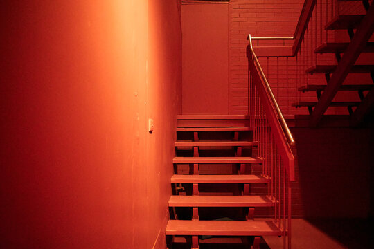 Empty stairwell glowing in orange light