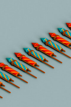 a row of many colorful fireworks rockets