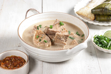Coto Makasar is Indonesian traditional food from Makasar, Sulawesi, served with Buras.
