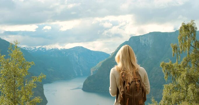 Adventure, travel and fun, woman taking a photo on a phone while enjoying scenic views from a mountain. Hiking tourist excited about beauty in nature while backpacking and exploring the outdoors