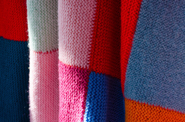 Colorful crochet wool blanket. Squares pattern.